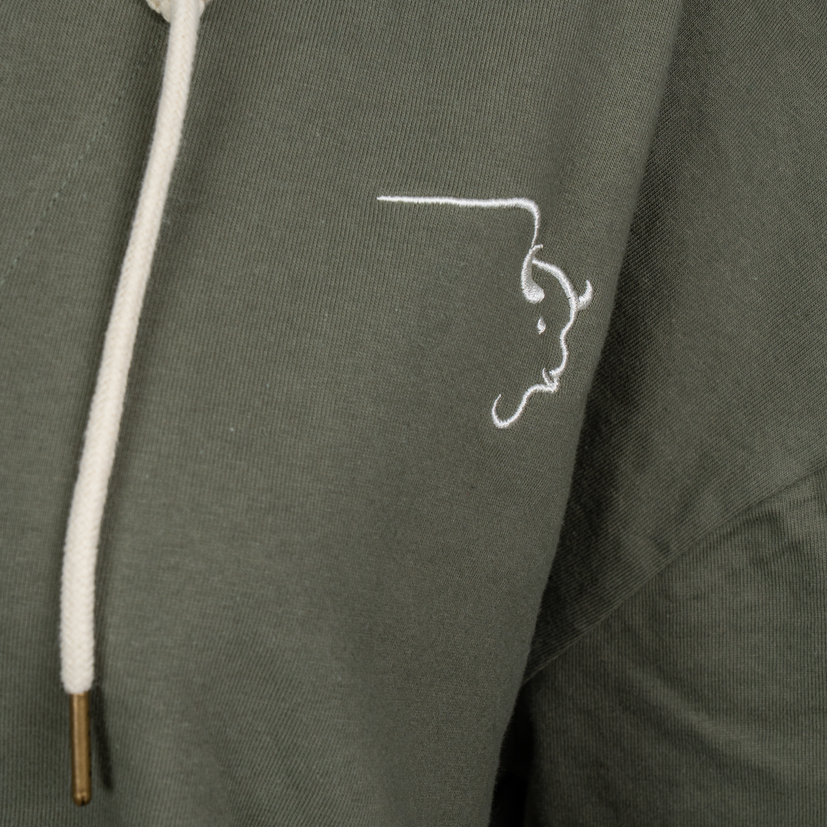 Buffalo Trace Women's Swoosh Hoodie close-up of embroidered swoosh logo and kangaroo pocket