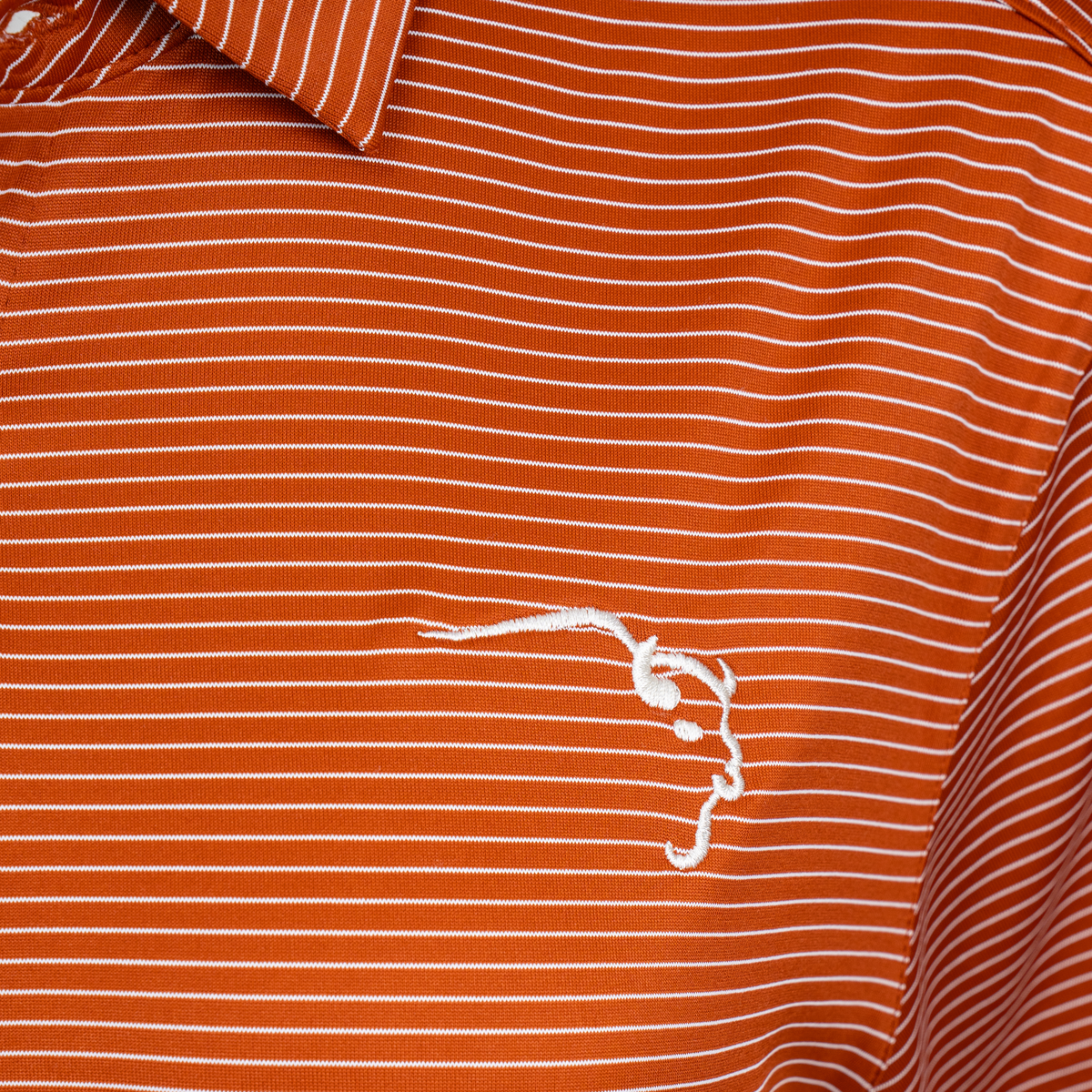 Cutter & Buck Orange Striped Polo close-up of embroidered Buffalo Trace logo on chest
