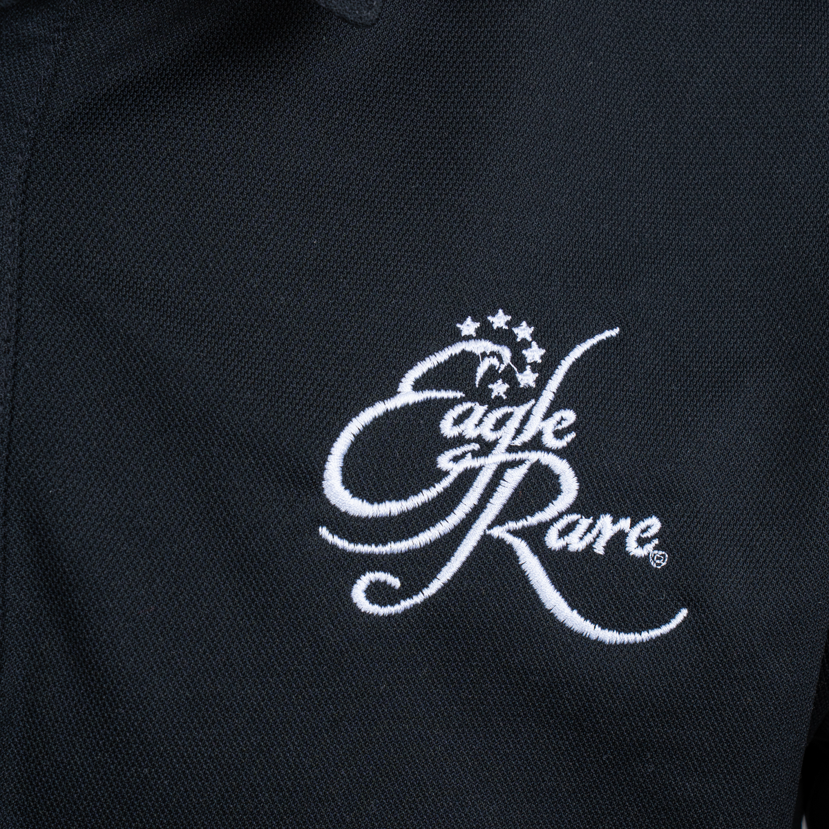 Eagle Rare Black Nike Polo close-up of embroidered Eagle Rare logo on Nike performance polo