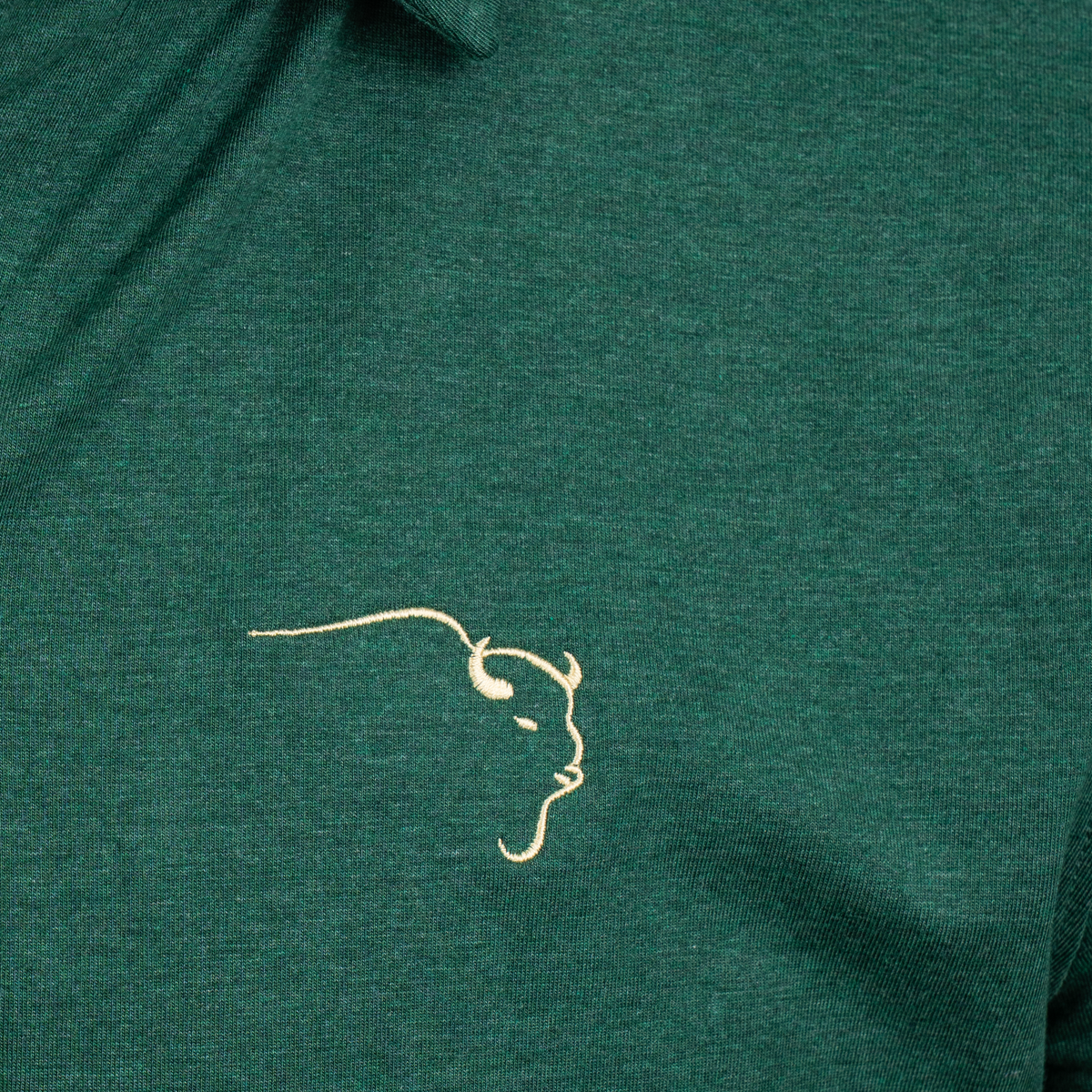 Buffalo Trace Green Long Sleeve Swoosh Polo close-up of embroidered swoosh logo on chest