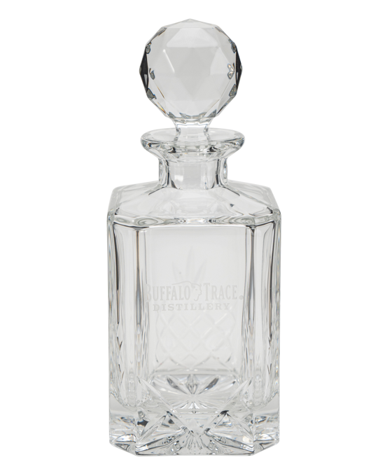Clear glass Buffalo Trace decanter with a spherical stopper on a white background