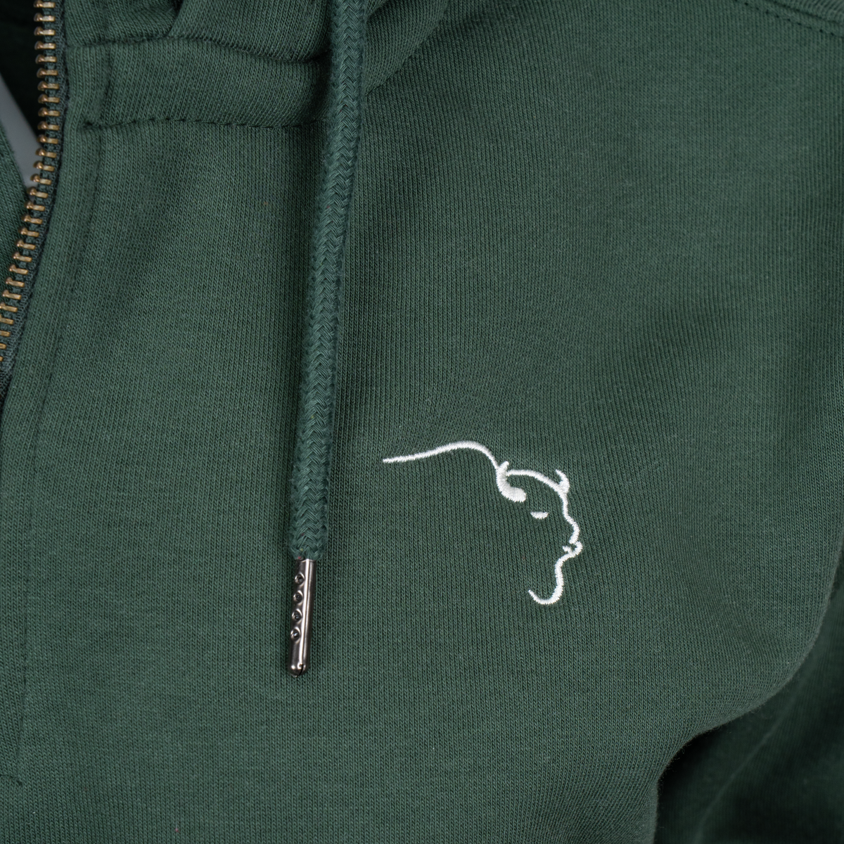 Buffalo Trace Green Half-Zip Hoodie close-up of embroidered chest logo and half-zip detail