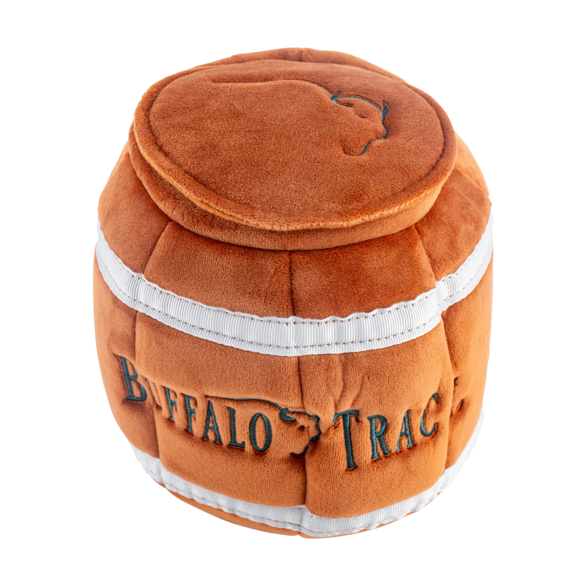 Buffalo Trace Barrel Plush Dog Toy held by dog – squeaky barrel toy for dogs of all sizes