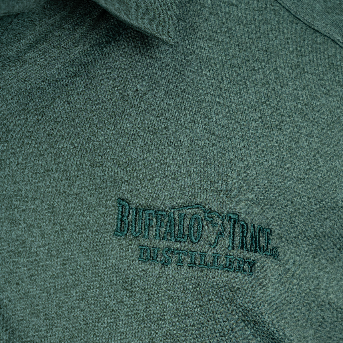 Buffalo Trace Cutter & Buck Green Polo close-up of embroidered Buffalo Trace logo on chest