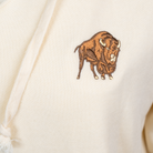 Buffalo Trace Women's Cream Hoodie close-up of embroidered Buffalo Trace logo on chest