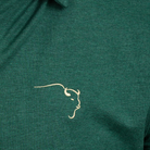 Buffalo Trace Green Long Sleeve Swoosh Polo close-up of embroidered swoosh logo on chest