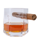 Glass with whiskey and a cigar on a white background